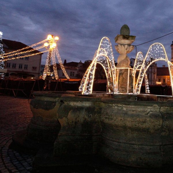 String lite decoration at a square and light arches simulating water of a fountain in the city of Uherské Hradiště, Czech Republic.