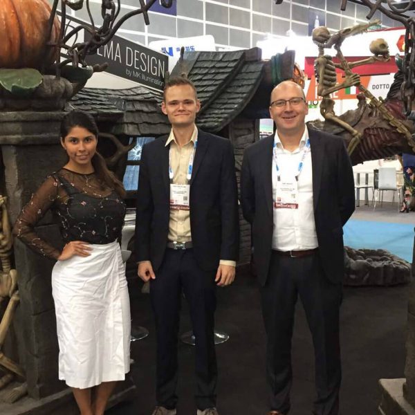 Team of Tema Design by MK Illumination in front of Halloween-based concept design at the IAAPA Asian Attractions Expo in the city of Hong Kong, China.