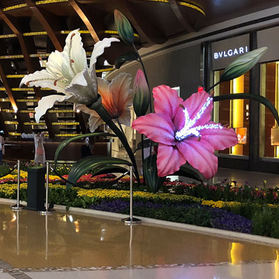 Fiberglass sculpture of lilie flowers with illuminated pistil inside the shopping center The Crystals in Las Vegas, United States of America.