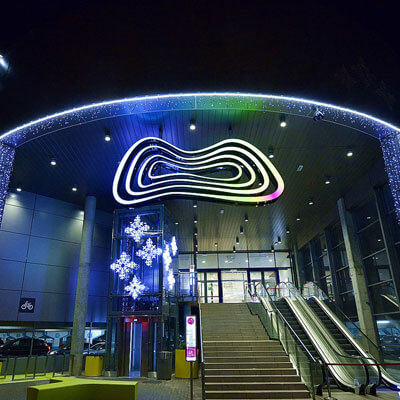 With string light decorated entrance of the shopping center Galeria Morena in the city of Gdańsk, Poland.