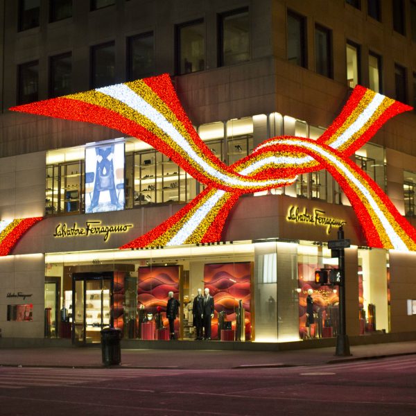Red, gold and white light motif at the facade of fashion boutique Salvatore Ferragamo at Fifth Avenue in New York City, United States of America.