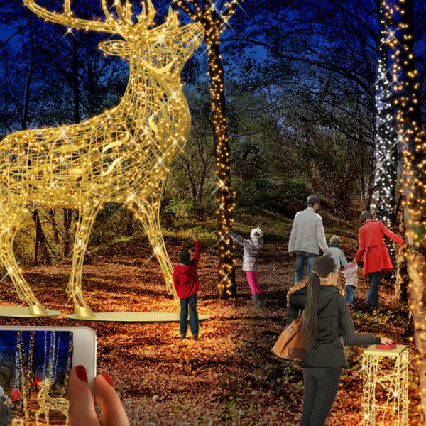 Light sculptures of a stag and deer between with string lite decorated trees at the Haldenzauber light park in the city of Hückelhoven, Germany.