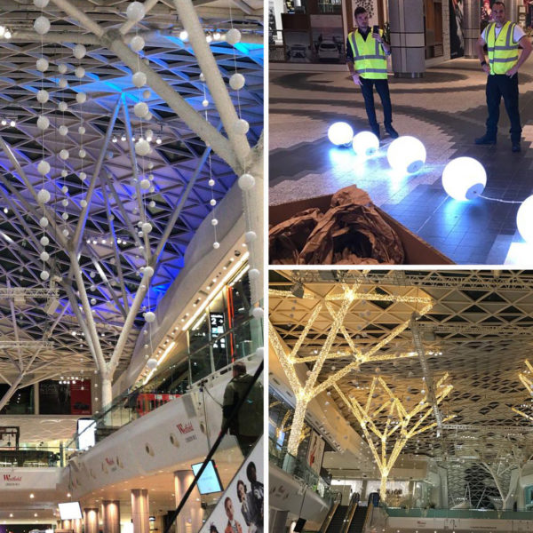 Pictures of the installation of light ball decoration in the shopping center Westfield London in the city of London, United Kingdom.