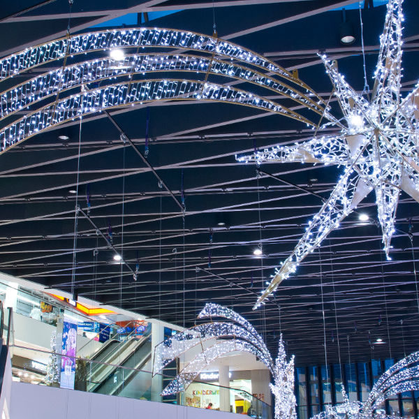 Light sculptures of white shooting stars in the shopping center Kaufhaus Tyrol in Innsbruck, Austria.