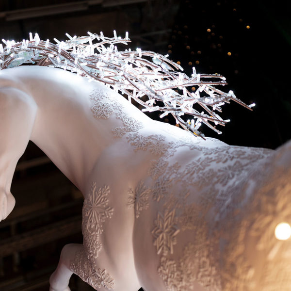 Close up view of illuminated fiberglass sculpture of an unicorn at Christmasworld 2019 trade fair in the city of Frankfurt, Germany.