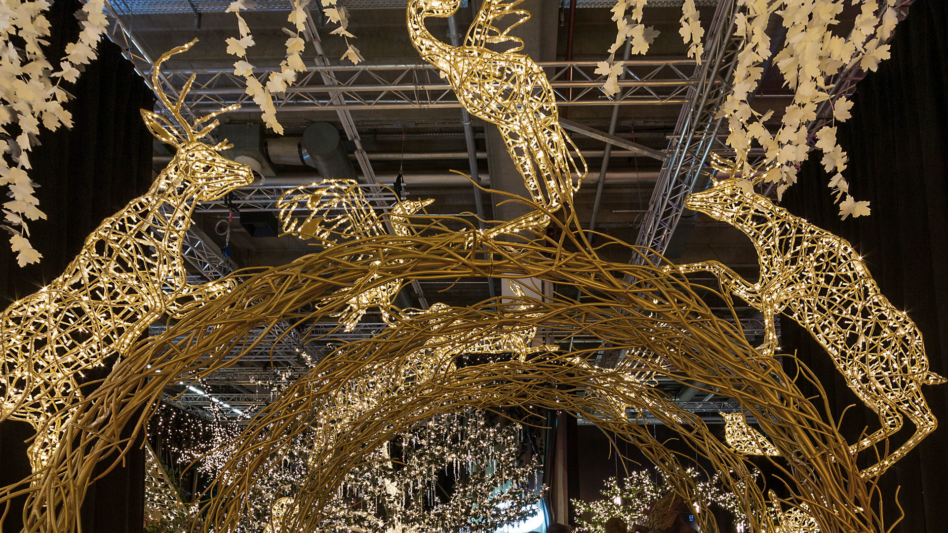 Close up view of "The Arch of Life" light installation with light sculptures of different forest animals at the showroom of MK Illumination Austria in the city of Innsbruck, Austria.