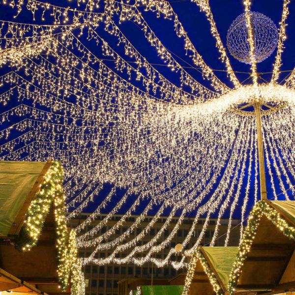 Giant string lite curtain straining across a christmas market in the city of Essen, Germany.